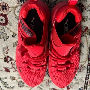 Kids red pumas size 2